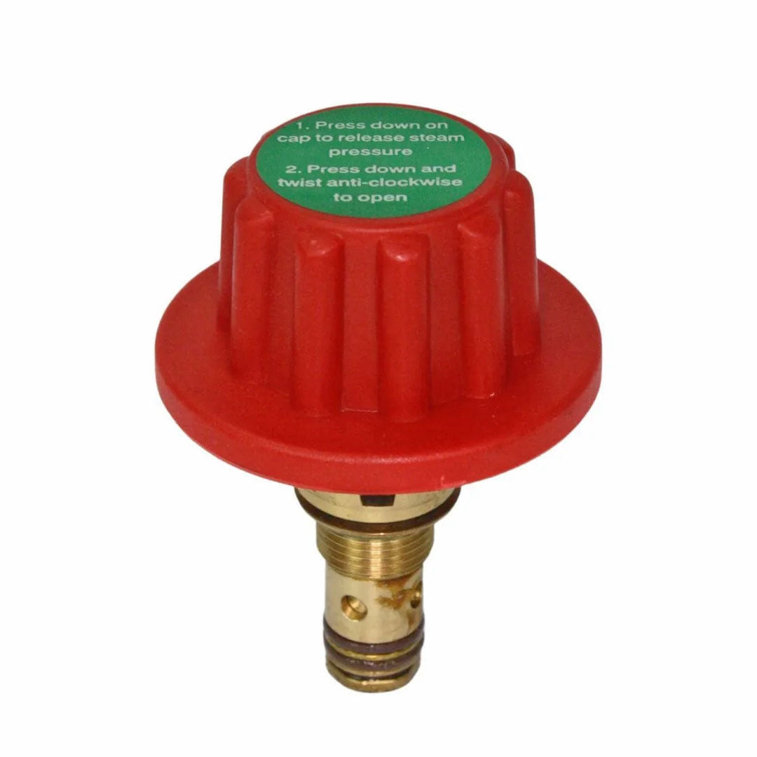 Angled view of Aqua Pro Steamer locking pressure cap with brass fitting and green instructional label.